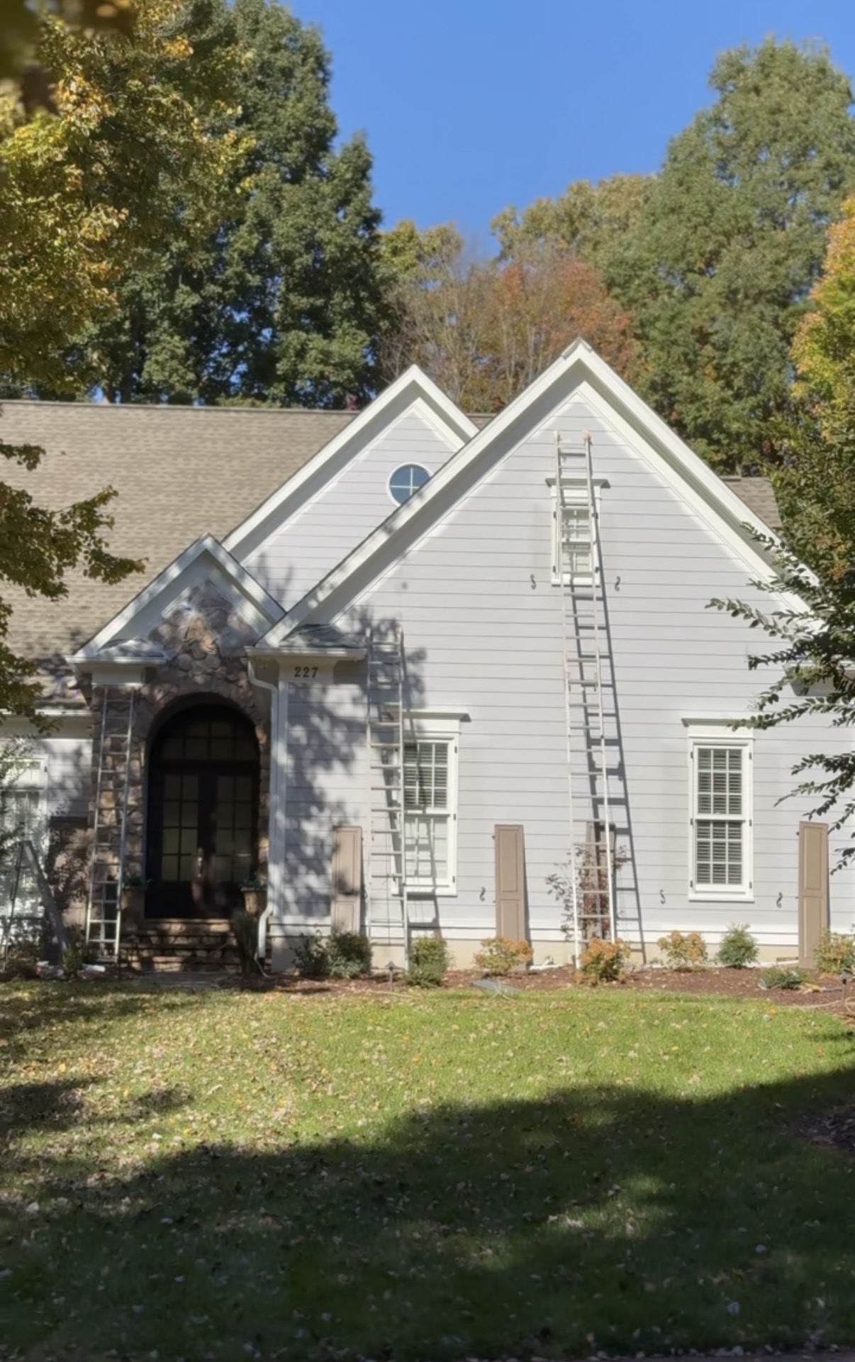 Front of the Mooresville home with ladders set up during the exterior repaint