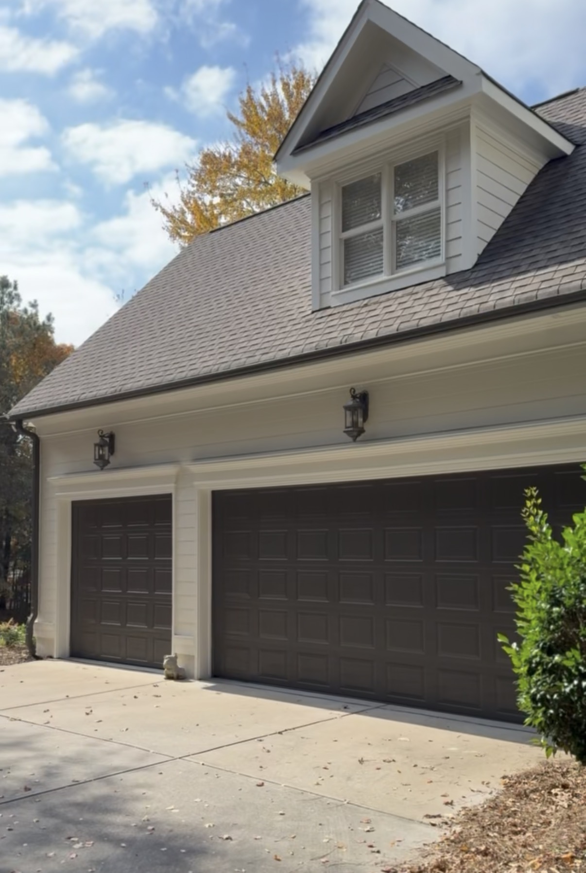 Garage side after painting with Urbane Bronze garage doors and Greek Villa trim in Mooresville
