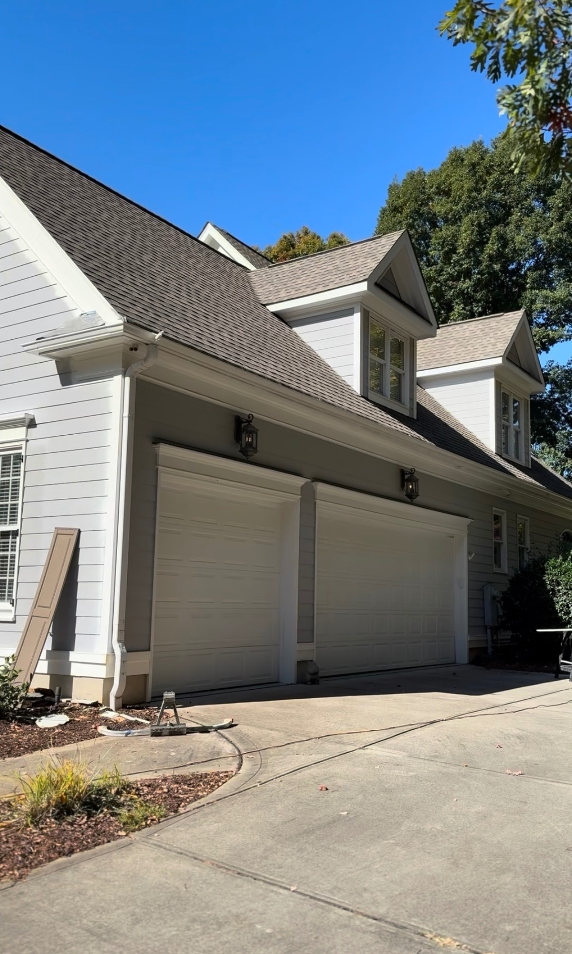 Garage side of the Mooresville home before shutters and garage doors were painted Urbane Bronze